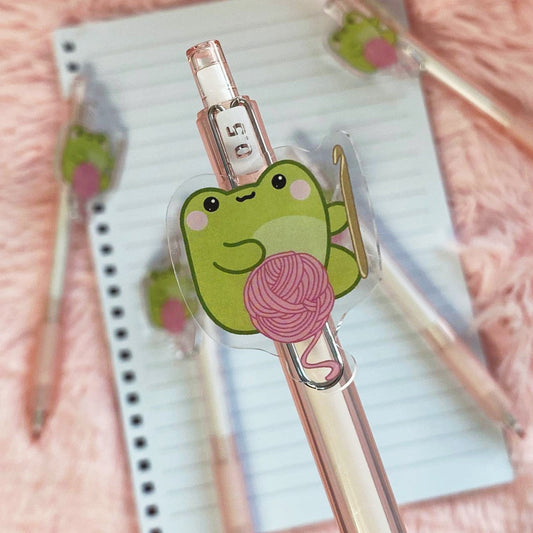 Ballpoint pen with a frog crochet charm