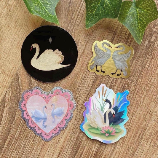 vintage swan sticker set 4 pack black swan gold foil pair pink glitter heart and holographic black and white swans with lotus on wooden table